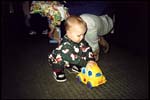 Andrew playing with a present