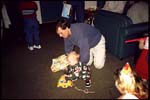 Peter trying to play with Andrew's present